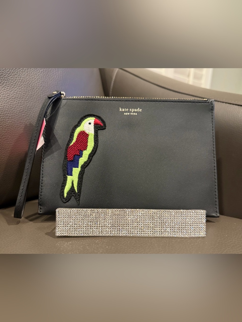 kate spade Black Wristlet with Colorful Parrot Patch